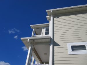 A close-up of seamless gutters and downspouts.
